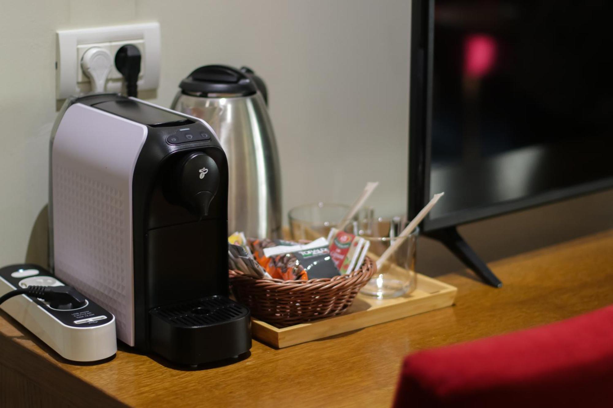 Opus Villa Sinaia Ngoại thất bức ảnh A Nespresso coffee machine in a hotel room